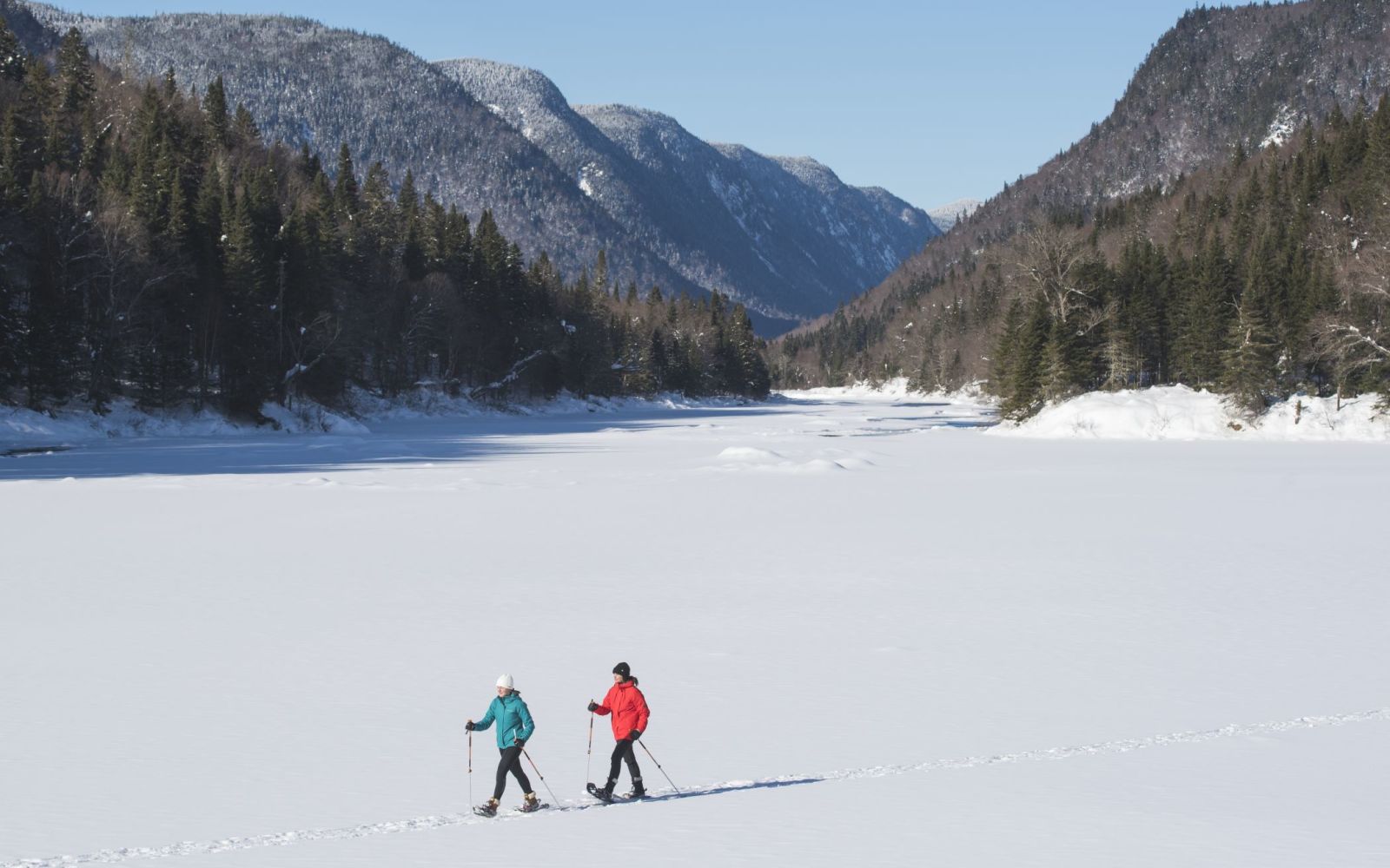 A Group Of People Cross Country Skiing On A Snow Covered Mountain